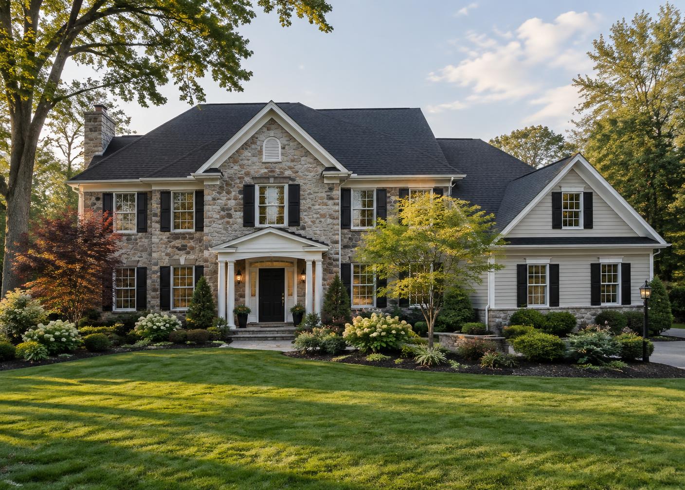 New Jersey colonial home with a newly replaced dark shingle roof